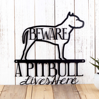 A Pitbull lives here metal sign, with beware, in matte black powder coat.