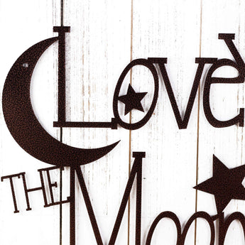 Close up of moon and stars on our Love You to the Moon and Back metal sign, in copper vein powder coat. 