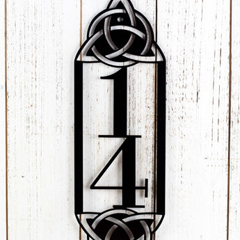 Close up of 2 digit vertical metal house number sign with Celtic Knots. 