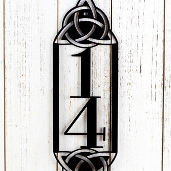 Close up of metal 2 digit vertical house number sign with Celtic knots, in matte black powder coat.