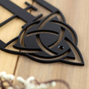 Close up of matte black powder coat on our 2 digit vertical metal house number sign with Celtic knots.