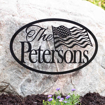 Custom oval family name metal plaque with American flag, in matte black powder coat.