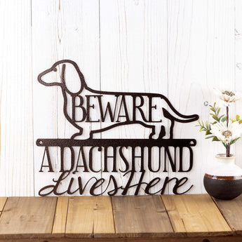 A Dachshund Lives Here metal wall art, with Beware, in copper vein powder coat. 