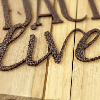 Close up of copper vein powder coat on our Dachshund metal wall art.