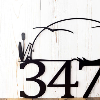 Close up of cattails on our metal house number sign, in matte black powder coat. 