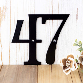Close up of 2 digit metal house number sign, in matte black powder coat. 