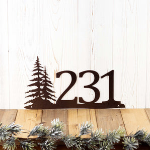 3 digit metal house number plaque with pine trees, in copper vein powder coat. 