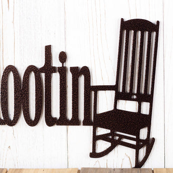 Close up of rocking chair on our Aint High Falootin metal sign, in copper vein powder coat.