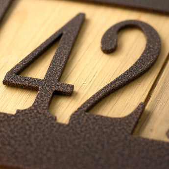 Close up of copper vein powder coat on our hanging metal address sign. 