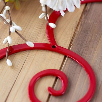 Close up of red gloss powder coat on our heart metal wall art. 