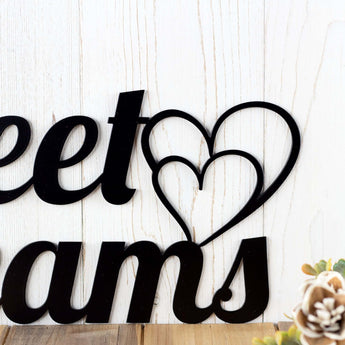 Close up of Hearts on our Sweet Dreams metal wall decor, in matte black powder coat. 