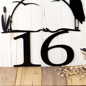 Close up of our 2 digit house number on our heron & cattails metal sign. 