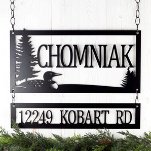 Hanging rectangular family name and address signs, with a loon and lake scene, in matte black powder coat. 