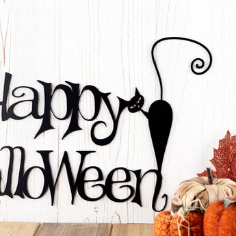 Close up Happy Halloween lettering on metal sign, in matte black powder coat. 