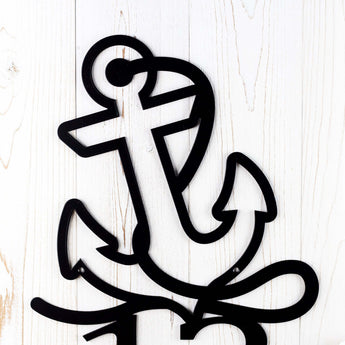 Close up of boat anchor on the metal house number sign, in matte black powder coat. 