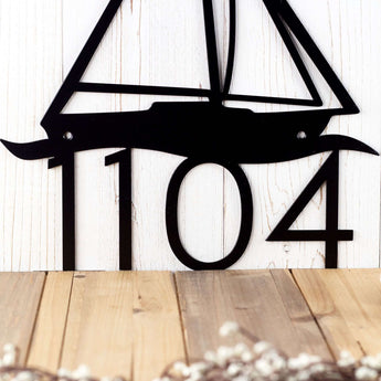 Close up of 4 digit house number on our metal address sign, in matte black powder coat. 