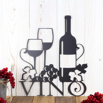 Close up of Vino metal wall art with wine glasses, bottle, and grapes, in silver vein powder coat. 