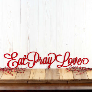 Eat Pray Love metal wall decor with cursive lettering, in red powder coat.