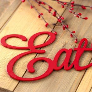 Close up of red gloss powder coat on our Eat Pray Love metal sign.