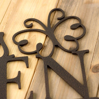Close up of copper vein powder coat on our garden name metal sign.