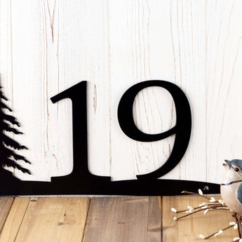 Close up of 2 digit house number on our pine trees metal sign, in matte black powder coat.