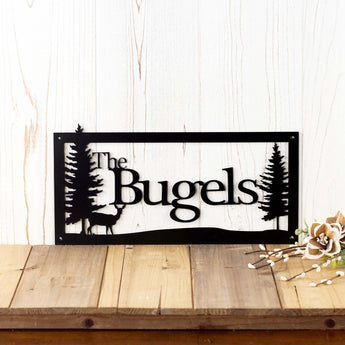 Personalized family name metal sign with doe deer silhouette, in matte black powder coat. 