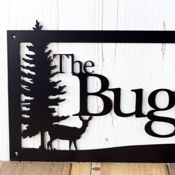 Close up of doe deer silhouette on our custom family name sign, in matte black powder coat.