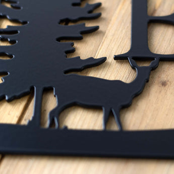 Close up of matte black powder coat on our family name sign. 