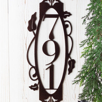 Close up of 3 digit vertical house number plaque, in copper vein powder coat. 