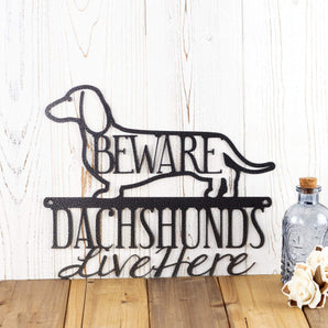 Dachshunds Live Here metal wall art, with Beware, in silver vein powder coat.