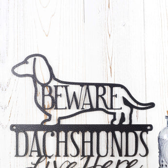 Close up of Dachshund dog silhouette with Beware on our Dachshund metal sign, in silver vein powder coat. 