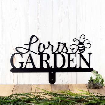 Garden name metal yard sign, with a bumble bee silhouette, in matte black powder coat. 