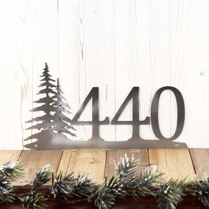 3 digit metal house number sign with pine trees, in raw steel. 