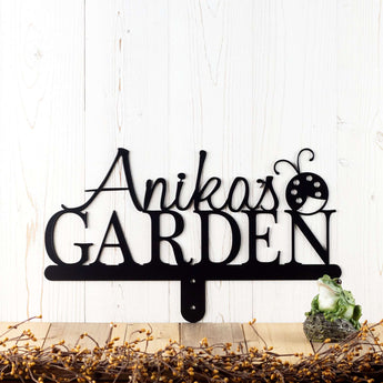 Custom garden name sign with first name and ladybug, in matte black powder coat. 