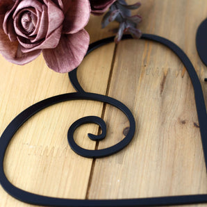 Close up of matte black powder coat on our God Bless our Home metal wall decor. 