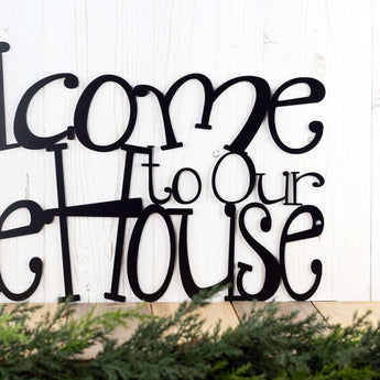 Close up of Welcome to Our Lake House wording on our metal wall decor, in matte black powder coat. 