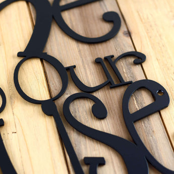 Close up of matte black powder coat on our Welcome to Our Lake House metal sign. 