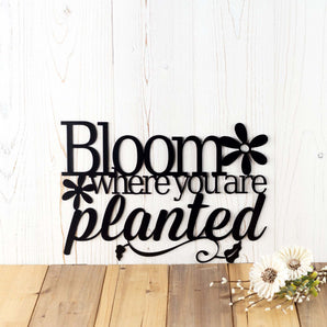 Bloom where you are Planted garden metal wall art, with flowers, in matte black powder coat.