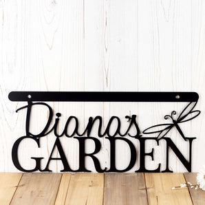 Close up of metal garden hanging sign with first name and dragonfly, in matte black powder coat. 