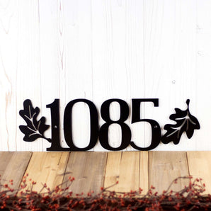4 digit metal house number plaque with oak leaves, in matte black powder coat.