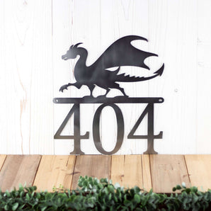 3 digit metal house number sign with a dragon silhouette, in raw steel. 