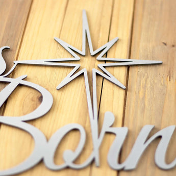 Close up of raw steel on our Unto Us a Savior is Born metal sign.