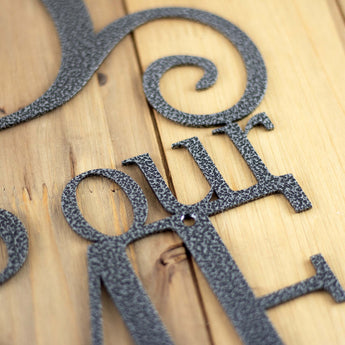 Close up of silver vein powder coat on our God Bless our Home metal wall decor. 