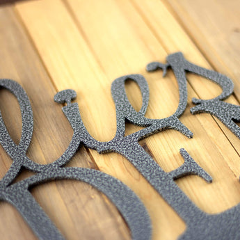 Close up of silver vein powder coat on our metal garden name sign.