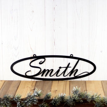 Oval personalized metal name plaque, in matte black powder coat. 