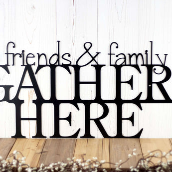 Close up of Friends and Family Gather Here metal wall art, in matte black powder coat.