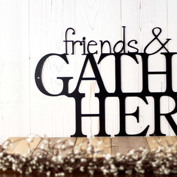 Close up of Friends and Family Gather Here metal wall art, in matte black powder coat. 
