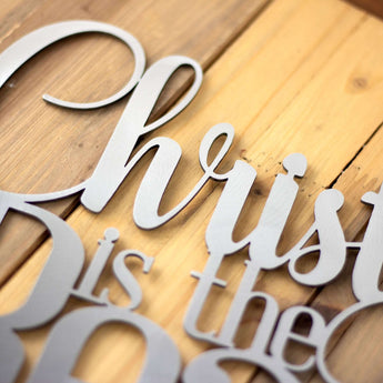 Close up of raw steel on our Christ Jesus is the reason for the season Christmas metal sign.