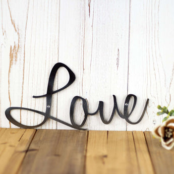 Close up of raw steel on our Live Laugh Love word wall art. 