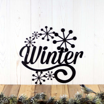 Winter metal wall decor with snowflakes, in matte black powder coat. 